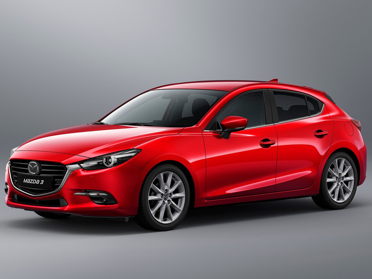 Mazda 3 хэтчбек 5-дв. (III поколение рестайлинг, 2016 - 2019 г.в.): вид спереди сбоку