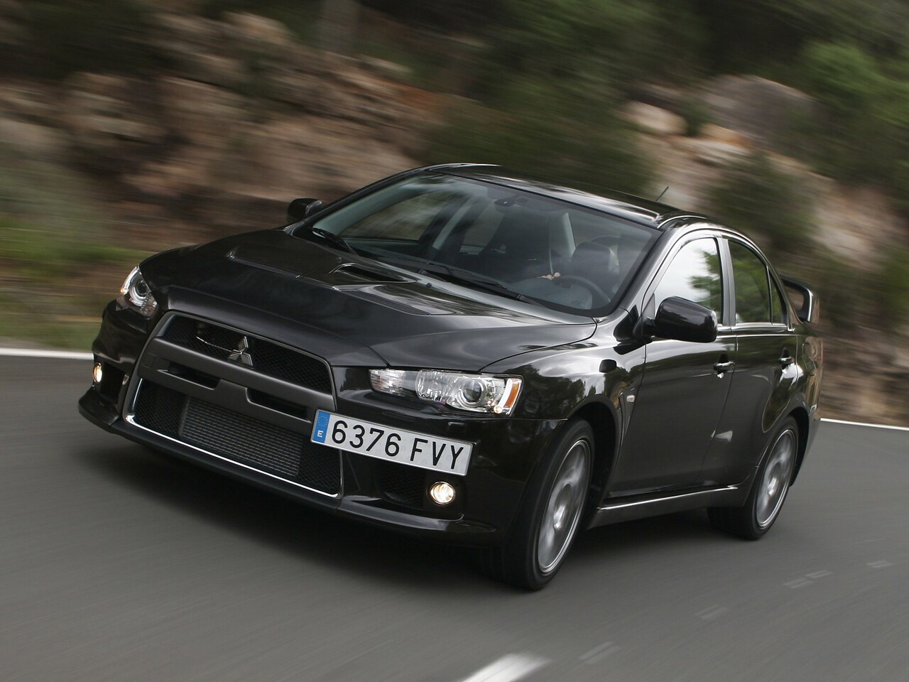 Mitsubishi Lancer Evolution 2.0 AT Ultimate (S03): Три четверти спереди в движении