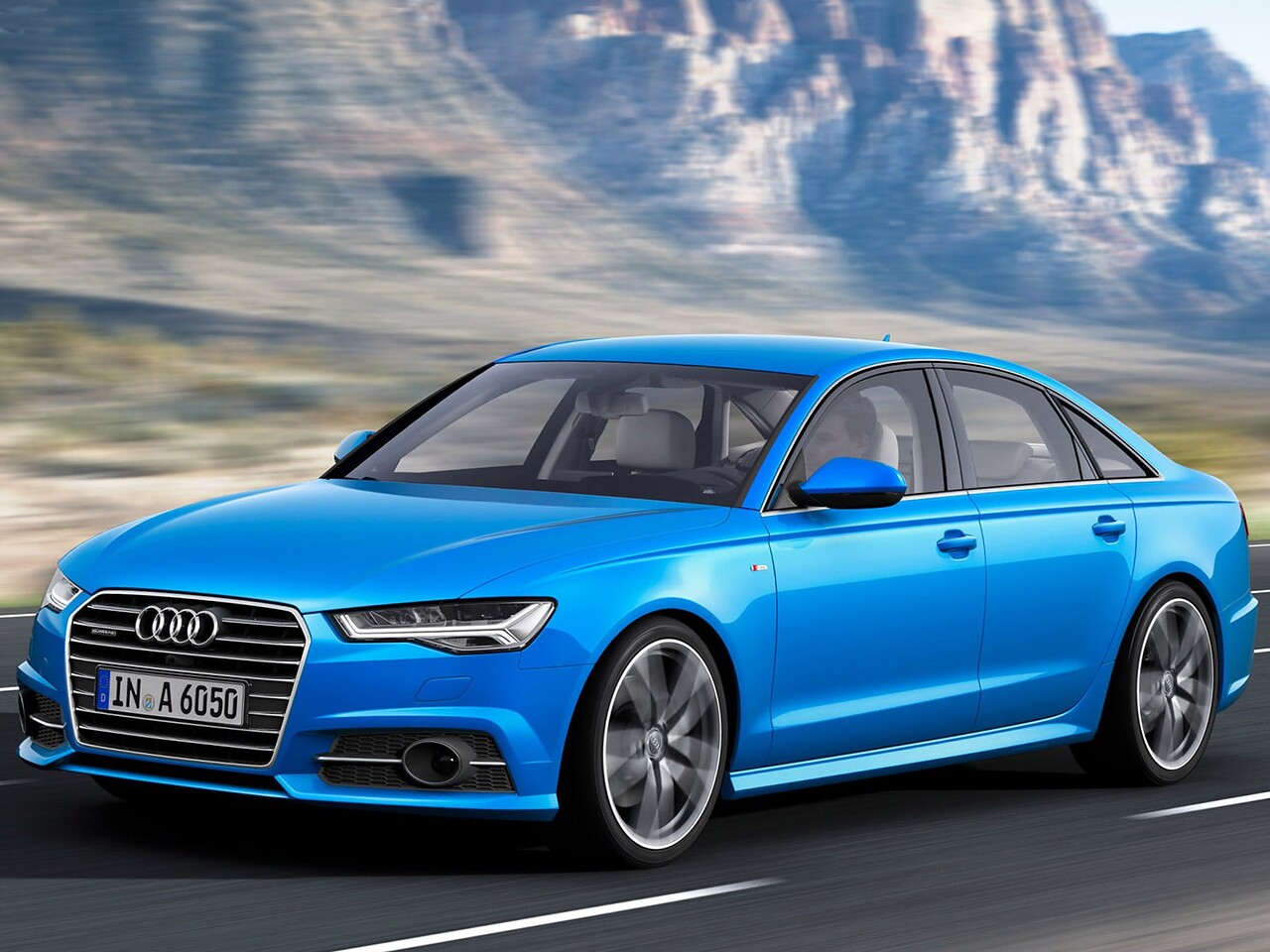 Audi A6 седан (C7 рестайлинг, 2014 - 2018 г.в.): вид спереди сбоку в движении