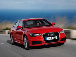 Audi A6 седан (C7, 2010 - 2014 г.в.): вид спереди сбоку в движении