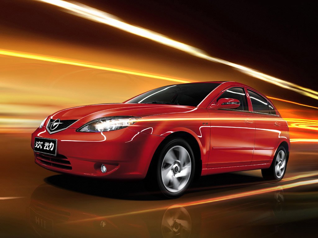 Haima 3 хэтчбек 5-дв. (I поколение, 2007 - 2013 г.в.): Три четверти спереди в движении, красный кузов