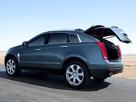 Cadillac SRX (II поколение, 2010 - 2014 г.в.): Тёмно-серый кроссовер с приоткрытой задней дверью