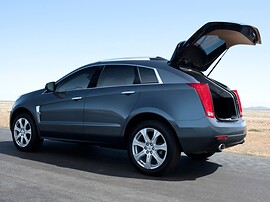 Cadillac SRX (II поколение, 2010 - 2014 г.в.): Тёмно-серый кроссовер с полностью открытой задней дверью