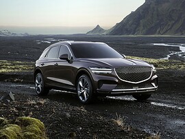 Genesis GV70 (I поколение, 2020 - 2022 г.в.): вид спереди сбоку в горах